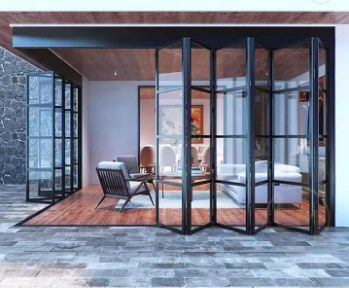 Black aluminum bifold patio door opening to an outdoor patio