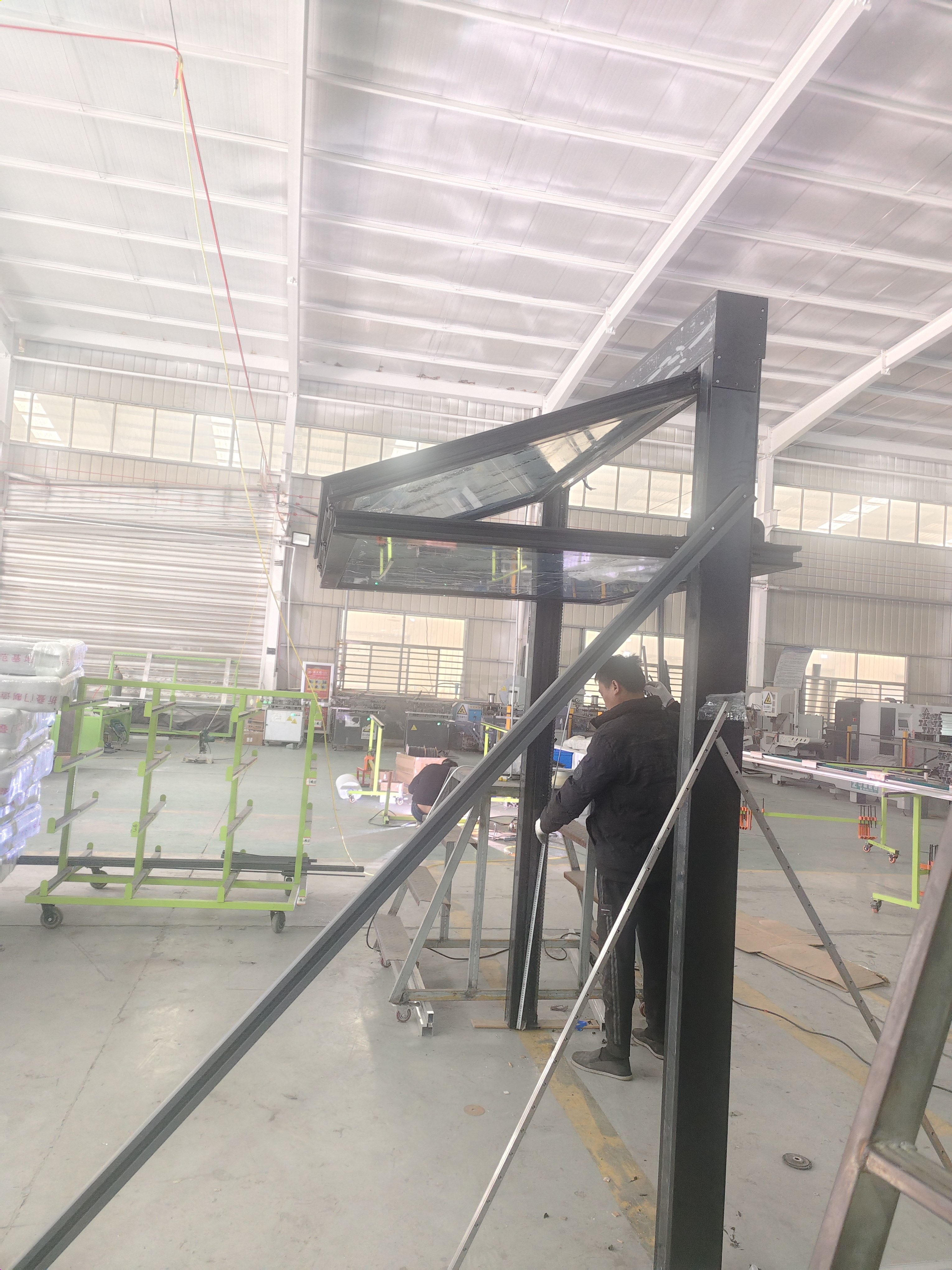 Large installed fold-up aluminum serving window