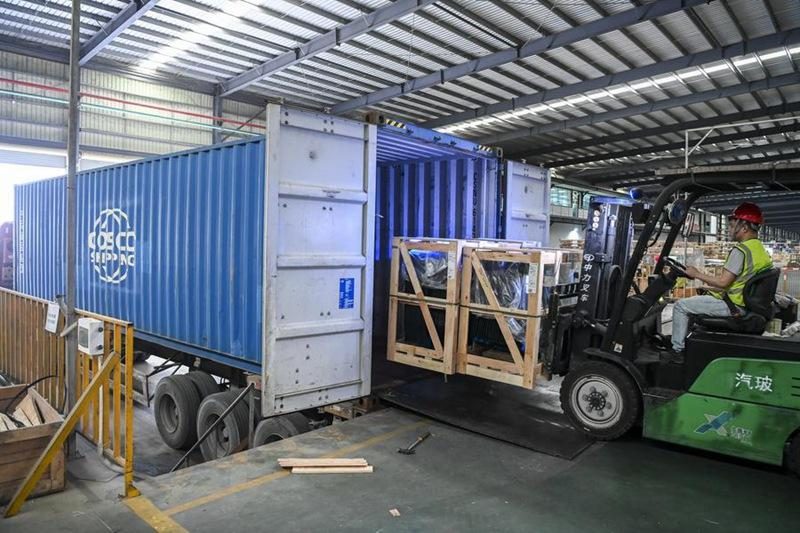 Crated window and door units loaded into shipping container